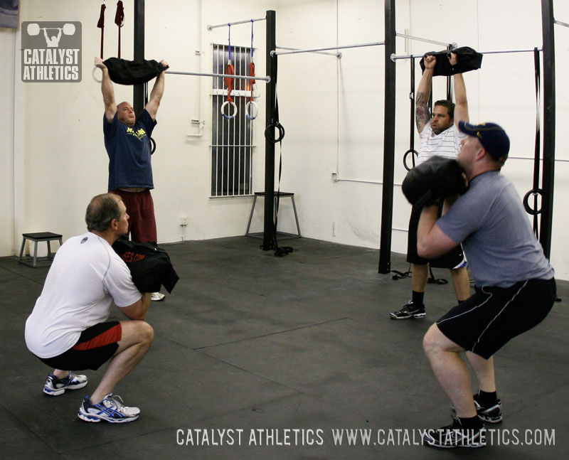 Sandbag clean + push press workout - Olympic Weightlifting, strength, conditioning, fitness, nutrition - Catalyst Athletics 