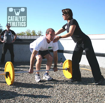 Lani instructing the deadlift at the Stone Clinic seminar about a million years ago. We miss you Lani! - Olympic Weightlifting, strength, conditioning, fitness, nutrition - Catalyst Athletics